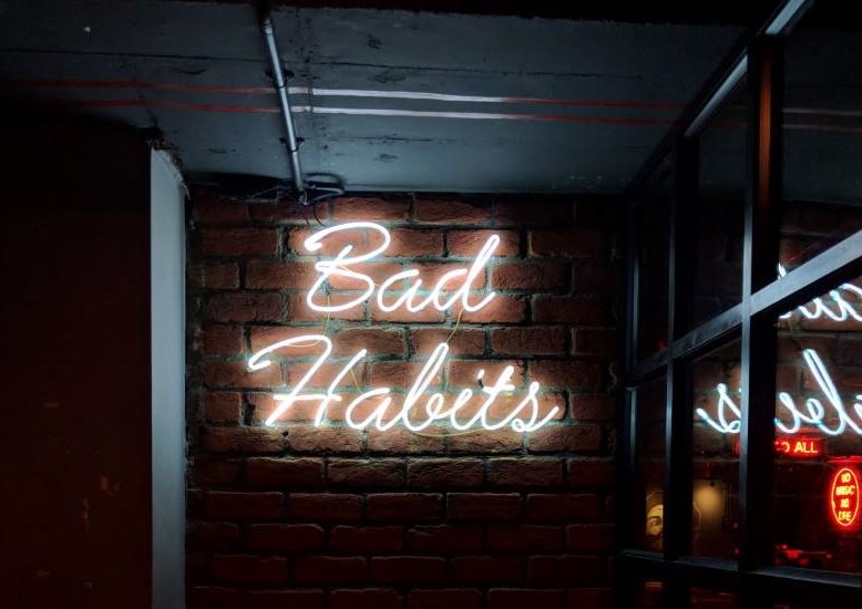 bad habits neon sign