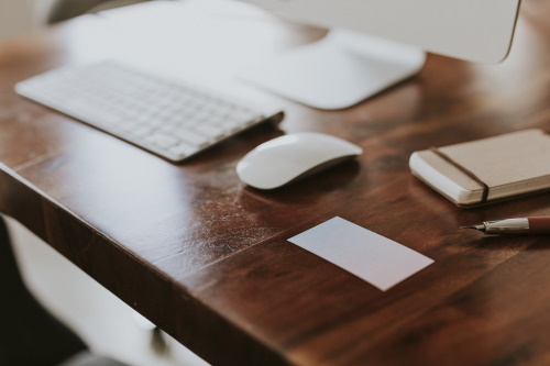 writing desk with computer and mouse