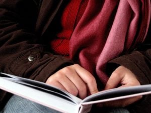 closeup of person reading a book