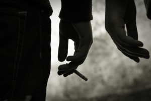 hand holding cigarette