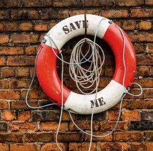 life preserver printed with the words save me