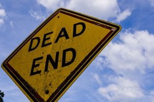 'dead end' road sign viewed from below