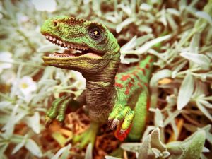 velociraptor model in grass