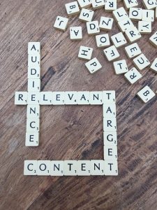 scrabble tiles spelling out 'audience', 'relevant', 'content'