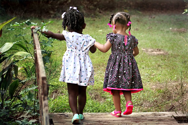 toddler friends holding hands